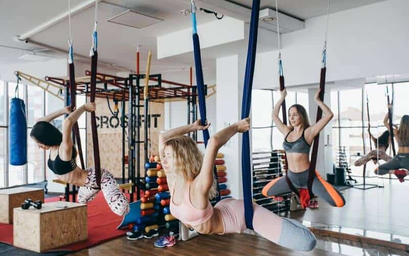 Women doing aerial yoga